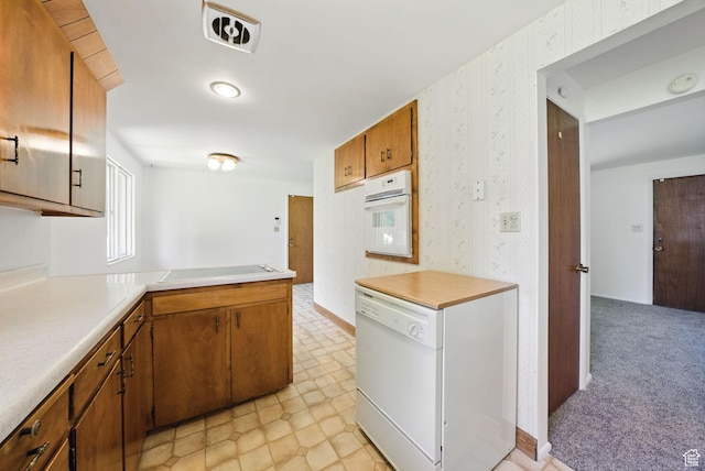 232 N 600 E, Orem, UT 84097 - kitchen with white appliances, light countertops, wallpapered walls, brown cabinetry, and a peninsula