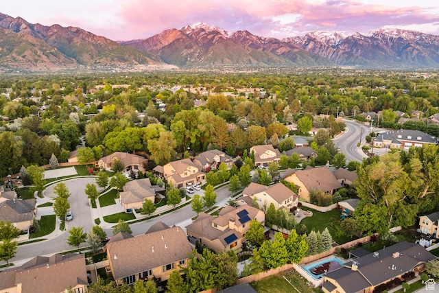 5972 S Ragsdale Dr, Murray, UT 84121 - aerial view at dusk of a mountain view and a residential view