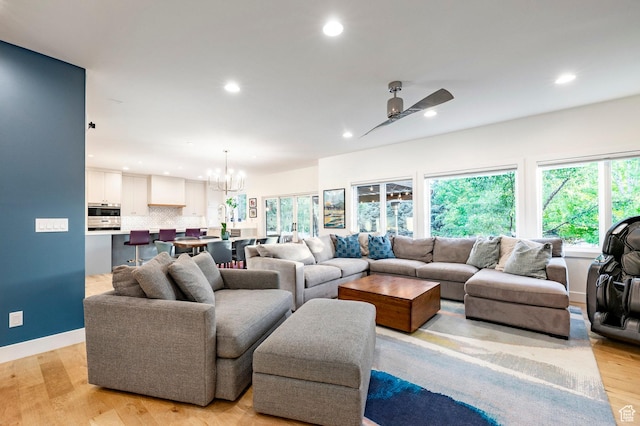 5972 S Ragsdale Dr, Murray, UT 84121 - living area featuring recessed lighting, plenty of natural light, a chandelier, and light wood-type flooring