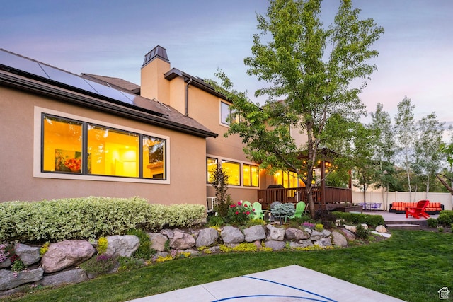 5972 S Ragsdale Dr, Murray, UT 84121 - yard at dusk featuring a patio area