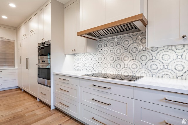5972 S Ragsdale Dr, Murray, UT 84121 - kitchen featuring black electric stovetop, stainless steel double oven, light countertops, recessed lighting, and decorative backsplash
