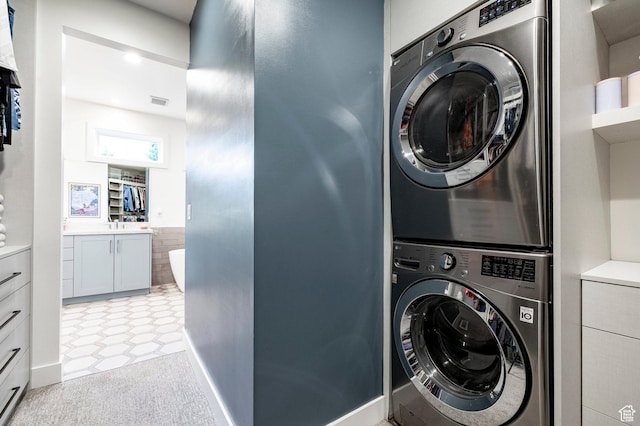 5972 S Ragsdale Dr, Murray, UT 84121 - laundry room featuring stacked washing machine and dryer
