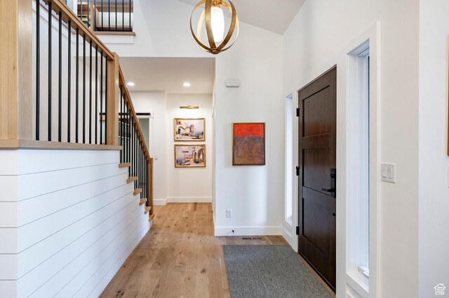 5972 S Ragsdale Dr, Murray, UT 84121 - entryway featuring wood finished floors, stairway, and baseboards