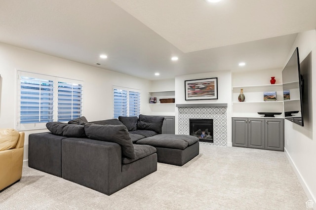 5972 S Ragsdale Dr, Murray, UT 84121 - living area featuring carpet flooring, recessed lighting, a tiled fireplace, and baseboards