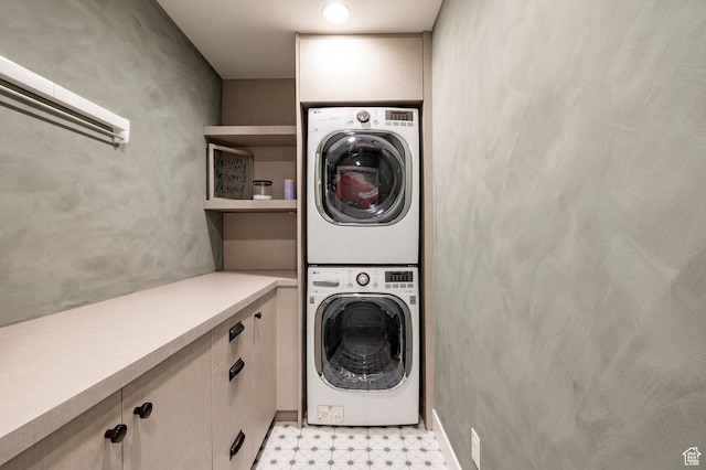 5972 S Ragsdale Dr, Murray, UT 84121 - laundry area featuring stacked washer and clothes dryer and light floors