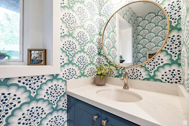 5972 S Ragsdale Dr, Murray, UT 84121 - bathroom featuring vanity, plenty of natural light, and wallpapered walls