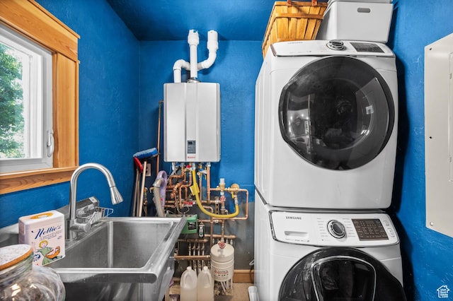 1503 S 300 E, Salt Lake City, UT 84115 - laundry room featuring stacked washer / dryer and tankless water heater
