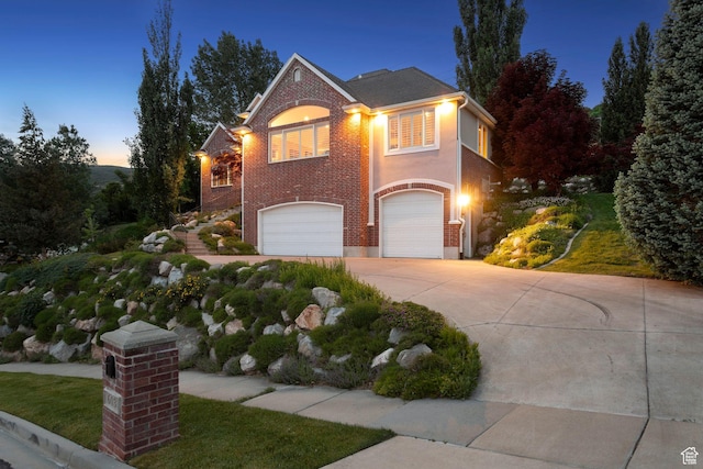 603 S Temple Hill Cir E, Bountiful, UT 84010 - traditional home with a garage, driveway, and brick siding