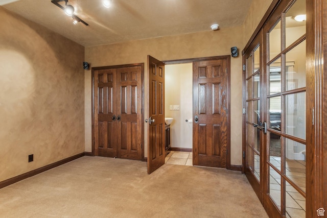 603 S Temple Hill Cir E, Bountiful, UT 84010 - entrance foyer with carpet, baseboards, and french doors