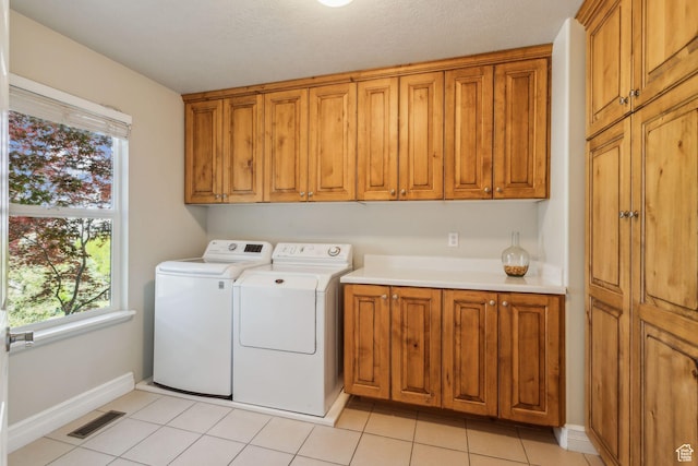 603 S Temple Hill Cir E, Bountiful, UT 84010 - laundry area featuring cabinet space, washer and dryer, plenty of natural light, and baseboards