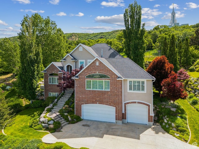 603 S Temple Hill Cir E, Bountiful, UT 84010 - traditional-style home featuring an attached garage, stairs, concrete driveway, and stucco siding