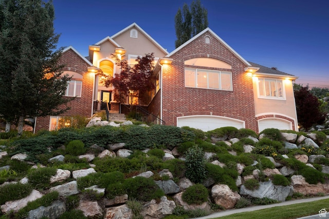 603 S Temple Hill Cir E, Bountiful, UT 84010 - traditional-style home featuring a garage, brick siding, and stucco siding