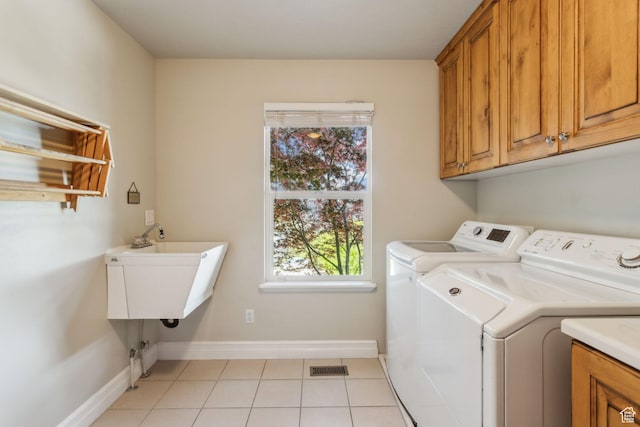 603 S Temple Hill Cir E, Bountiful, UT 84010 - laundry room with cabinet space, washing machine and clothes dryer, light tile patterned flooring, and baseboards