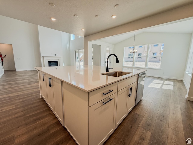 891 W Fallow Dr Unit 211, Saratoga Springs, UT 84045 - kitchen with dark wood-type flooring, a center island with sink, vaulted ceiling, a chandelier, and stainless steel dishwasher