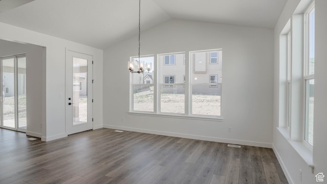 891 W Fallow Dr Unit 211, Saratoga Springs, UT 84045 - unfurnished dining area featuring a chandelier, dark wood-style flooring, and lofted ceiling