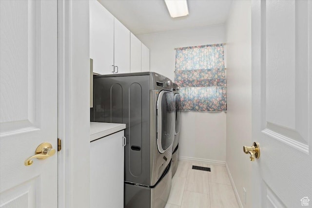 938 E Bernay Cir, Sandy, UT 84094 - laundry area with cabinet space, separate washer and dryer, baseboards, and light tile patterned flooring