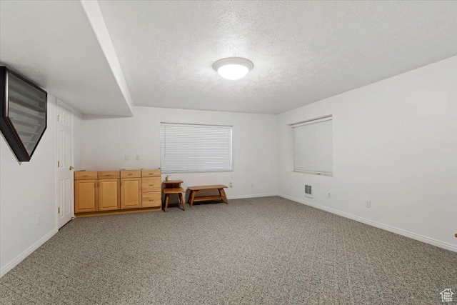 938 E Bernay Cir, Sandy, UT 84094 - bonus room with a textured ceiling, light carpet, and baseboards