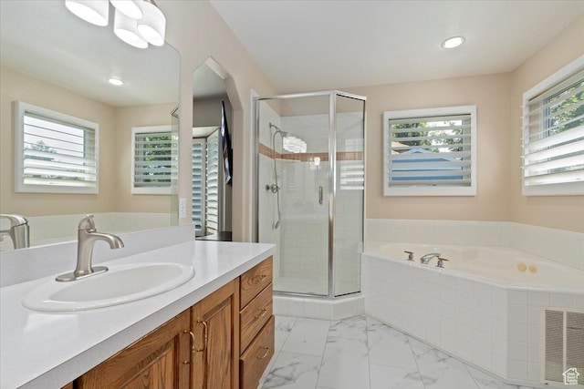 938 E Bernay Cir, Sandy, UT 84094 - bathroom featuring a garden tub, vanity, a shower stall, marble finish floors, and recessed lighting