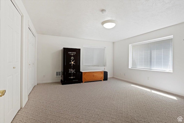 938 E Bernay Cir, Sandy, UT 84094 - unfurnished bedroom featuring carpet flooring, baseboards, and a textured ceiling