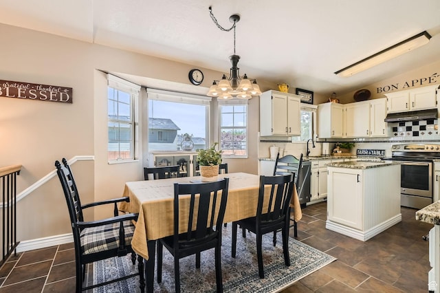 2638 W Cambridge Cross Cir, Riverton, UT 84065 - dining room featuring plenty of natural light, a chandelier, and baseboards