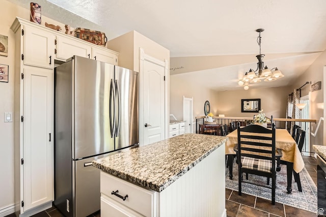 2638 W Cambridge Cross Cir, Riverton, UT 84065 - kitchen with freestanding refrigerator, a chandelier, white cabinetry, a center island, and light stone counters