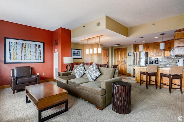 3855 Grand Summit Dr Unit 214Q1, Park City, UT 84098 - living room featuring light colored carpet, baseboards, and recessed lighting