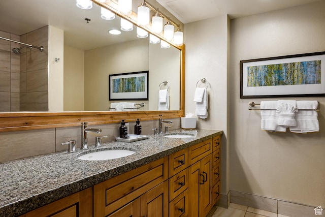 3855 Grand Summit Dr Unit 214Q1, Park City, UT 84098 - full bathroom featuring tile patterned floors, double vanity, baseboards, and a shower
