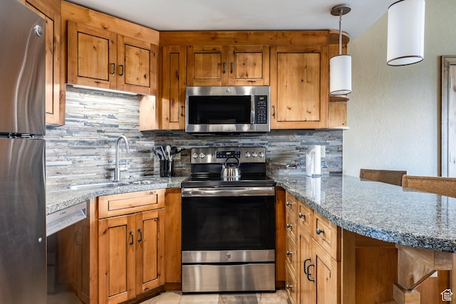 3855 Grand Summit Dr Unit 214Q1, Park City, UT 84098 - kitchen with appliances with stainless steel finishes, a sink, brown cabinetry, and tasteful backsplash