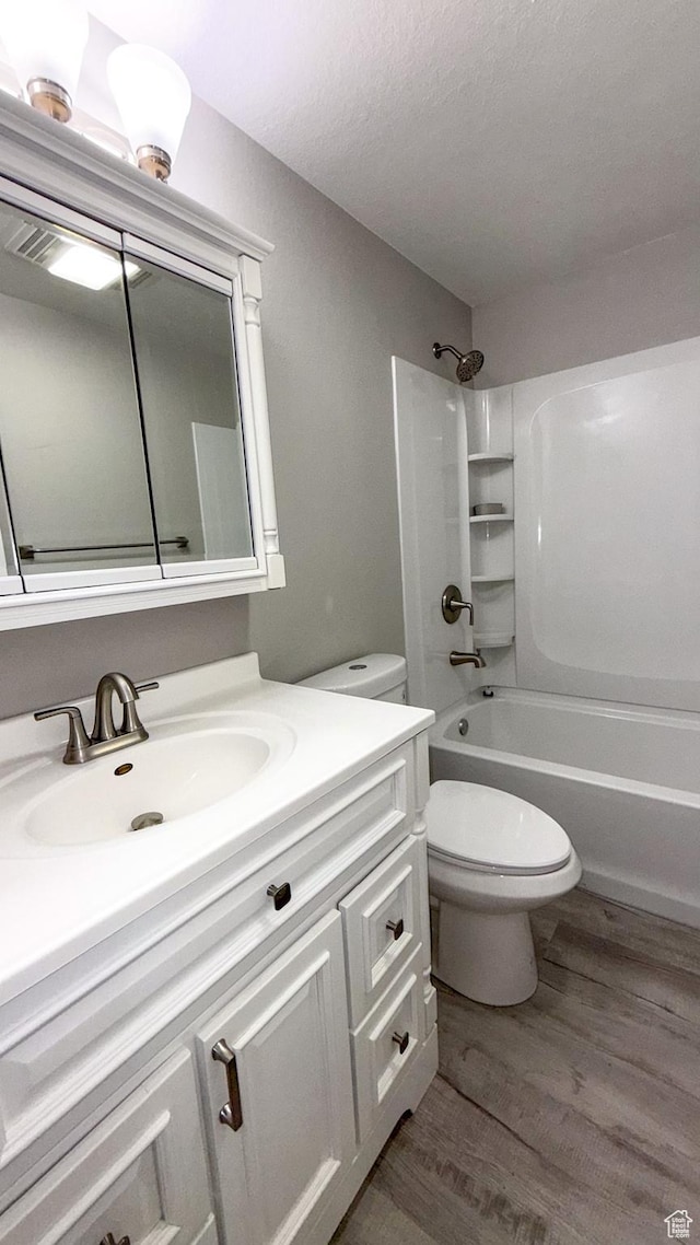 230 S 700 W, Price, UT 84501 - bathroom with toilet, wood finished floors, vanity, and shower / washtub combination