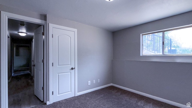 230 S 700 W, Price, UT 84501 - unfurnished bedroom featuring dark colored carpet and baseboards