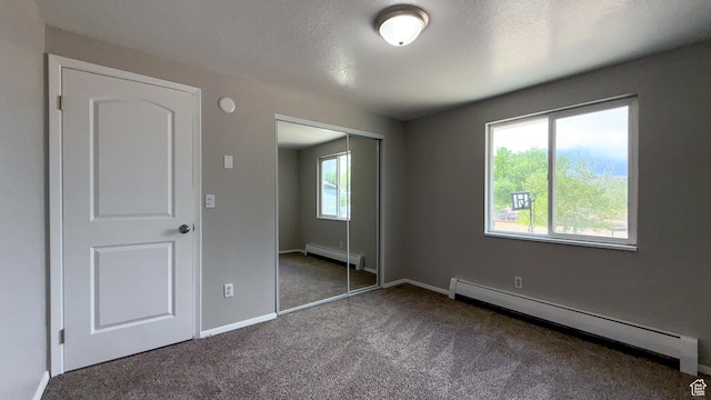 230 S 700 W, Price, UT 84501 - unfurnished bedroom featuring baseboard heating, carpet flooring, a closet, and baseboards