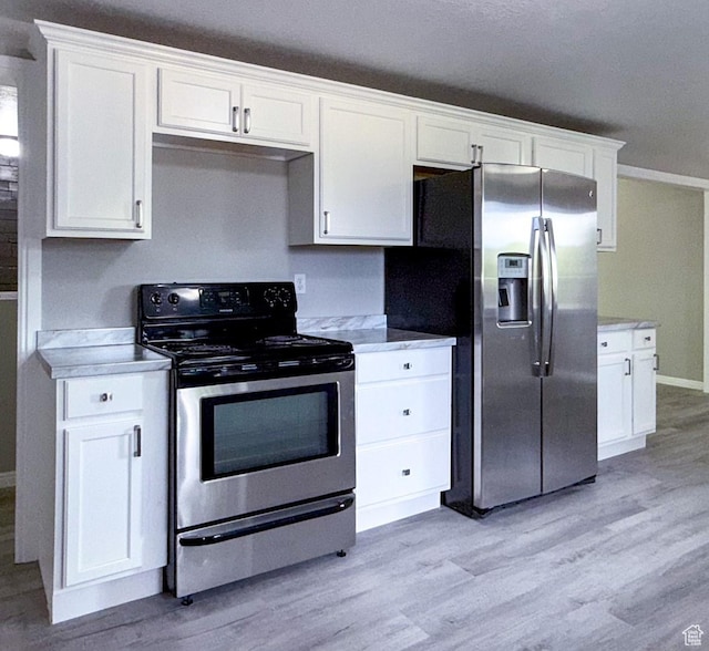 230 S 700 W, Price, UT 84501 - kitchen featuring appliances with stainless steel finishes, light wood-style flooring, and light countertops