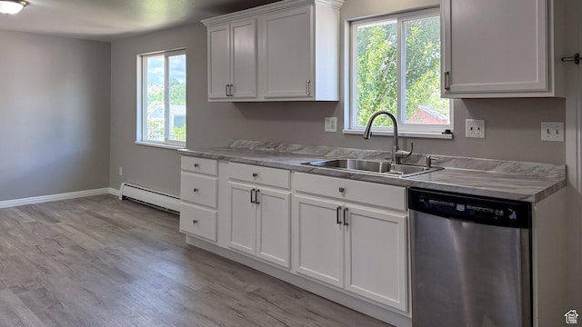 230 S 700 W, Price, UT 84501 - kitchen with dishwasher, baseboard heating, a sink, light wood finished floors, and light countertops