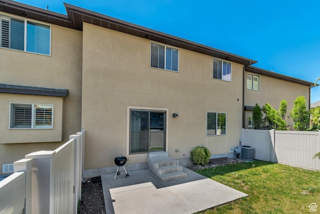 7259 S Viansa Ct, Midvale, UT 84047 - back of property with a patio area, stucco siding, entry steps, and central air condition unit