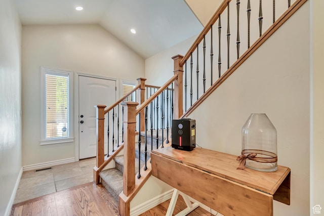 7259 S Viansa Ct, Midvale, UT 84047 - entryway featuring stairway, light wood-style floors, recessed lighting, baseboards, and high vaulted ceiling