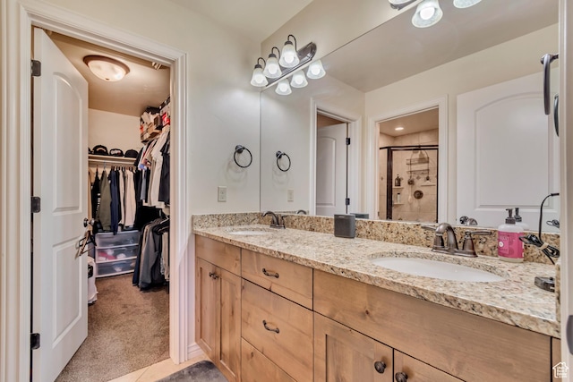 7259 S Viansa Ct, Midvale, UT 84047 - full bathroom featuring a stall shower, double vanity, and a walk in closet