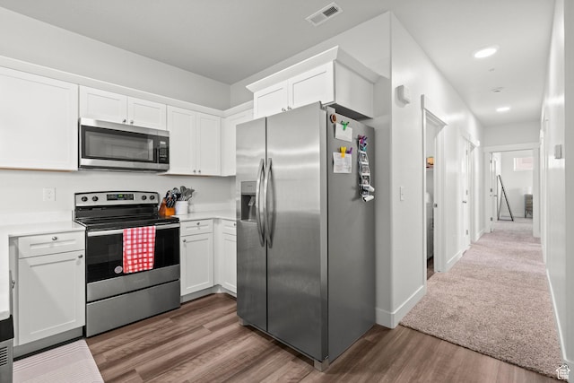 972 W Spider Green Way N Unit E302, Saratoga Springs, UT 84045 - kitchen with appliances with stainless steel finishes, white cabinets, wood finished floors, and recessed lighting
