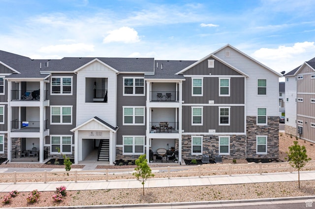 972 W Spider Green Way N Unit E302, Saratoga Springs, UT 84045 - view of property featuring board and batten siding and stone siding
