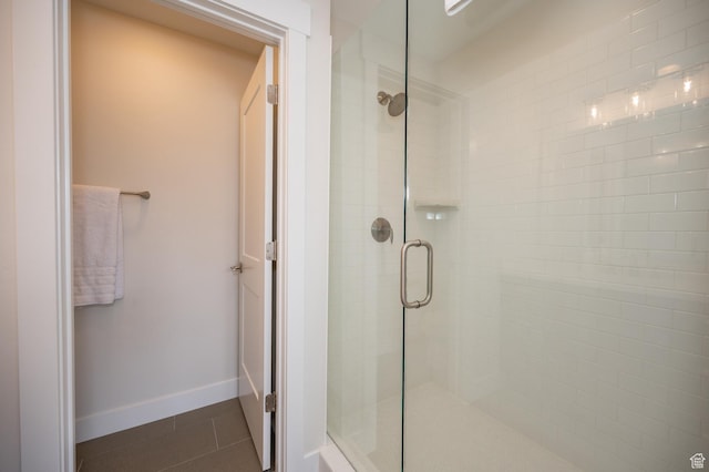 1097 W Wasatch Spring Rd, Kamas, UT 84036 - bathroom featuring a shower stall, baseboards, and tile patterned floors