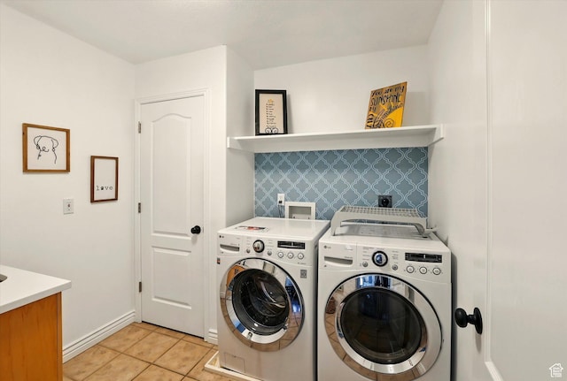 774 W 2300 S, Syracuse, UT 84075 - laundry room featuring washer and clothes dryer, light tile patterned flooring, and baseboards