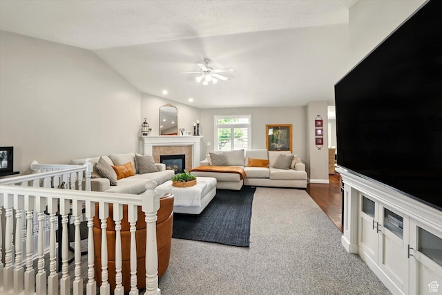 774 W 2300 S, Syracuse, UT 84075 - living area featuring ceiling fan, a tile fireplace, vaulted ceiling, and baseboards