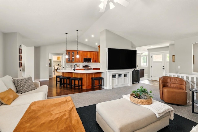 774 W 2300 S, Syracuse, UT 84075 - living room with lofted ceiling, washer / dryer, ceiling fan, and baseboards