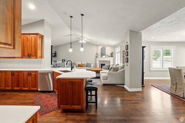 774 W 2300 S, Syracuse, UT 84075 - kitchen featuring stainless steel dishwasher, a sink, a peninsula, dark wood-style flooring, and lofted ceiling