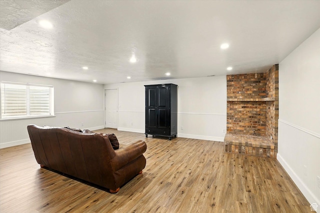 774 W 2300 S, Syracuse, UT 84075 - living room with light wood finished floors, recessed lighting, and baseboards