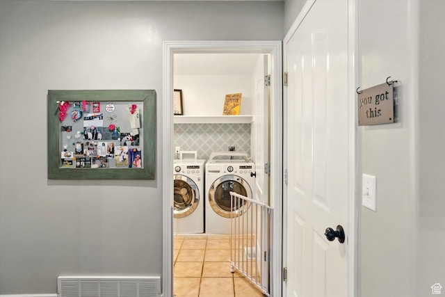 774 W 2300 S, Syracuse, UT 84075 - washroom featuring washer and dryer and light tile patterned floors