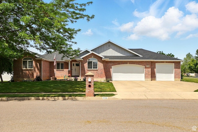 774 W 2300 S, Syracuse, UT 84075 - ranch-style house featuring an attached garage, driveway, a front lawn, and brick siding