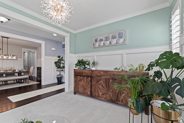 5284 W Orchard Spring Dr S, Herriman, UT 84096 - foyer entrance featuring a chandelier, crown molding, a decorative wall, and wainscoting