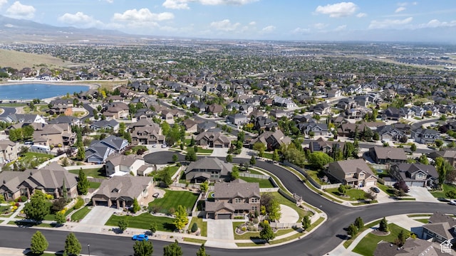 5284 W Orchard Spring Dr S, Herriman, UT 84096 - aerial view of property and surrounding area with nearby suburban area and a mountainous background