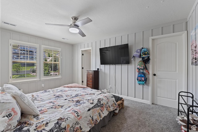 5284 W Orchard Spring Dr S, Herriman, UT 84096 - bedroom featuring carpet flooring, a textured ceiling, a ceiling fan, and a decorative wall