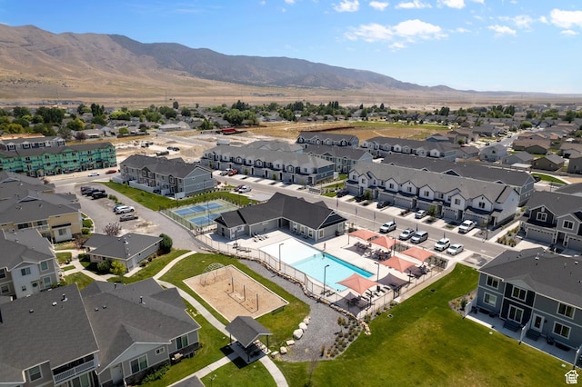 1893 E Thunder Ln Unit 497, Eagle Mountain, UT 84005 - aerial view of residential area with a pool area and mountains
